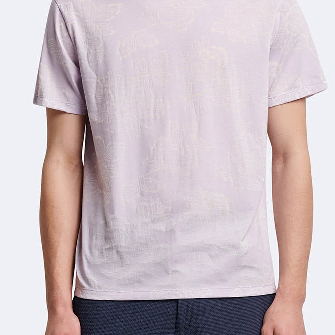 T-shirt fleuri à manches courtes et col rond Devred adapté par Adapt & Joy, offrant élégance, confort et facilité d'habillage pour les personnes en situation de handicap ou seniors.