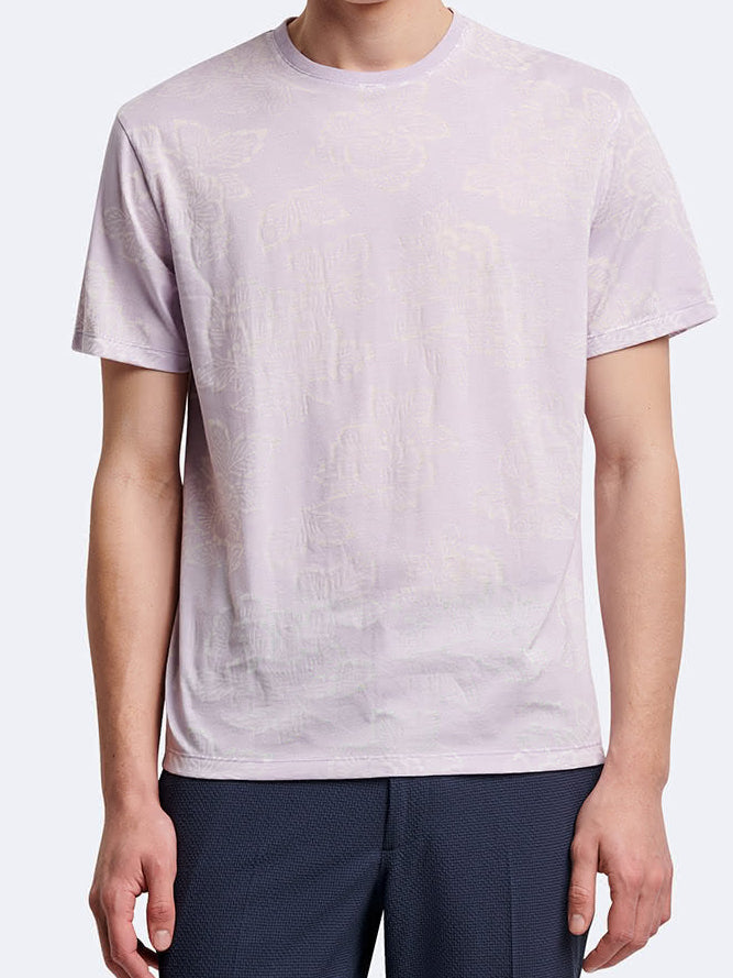 T-shirt fleuri à manches courtes et col rond Devred adapté par Adapt & Joy, offrant élégance, confort et facilité d'habillage pour les personnes en situation de handicap ou seniors.