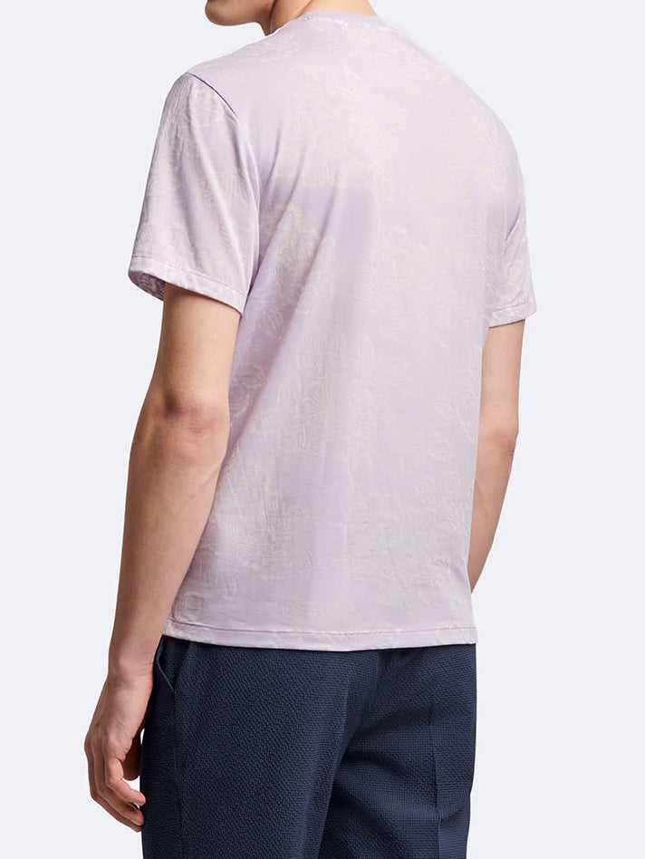T-shirt fleuri à manches courtes et col rond Devred adapté par Adapt & Joy, offrant élégance, confort et facilité d'habillage pour les personnes en situation de handicap ou seniors.